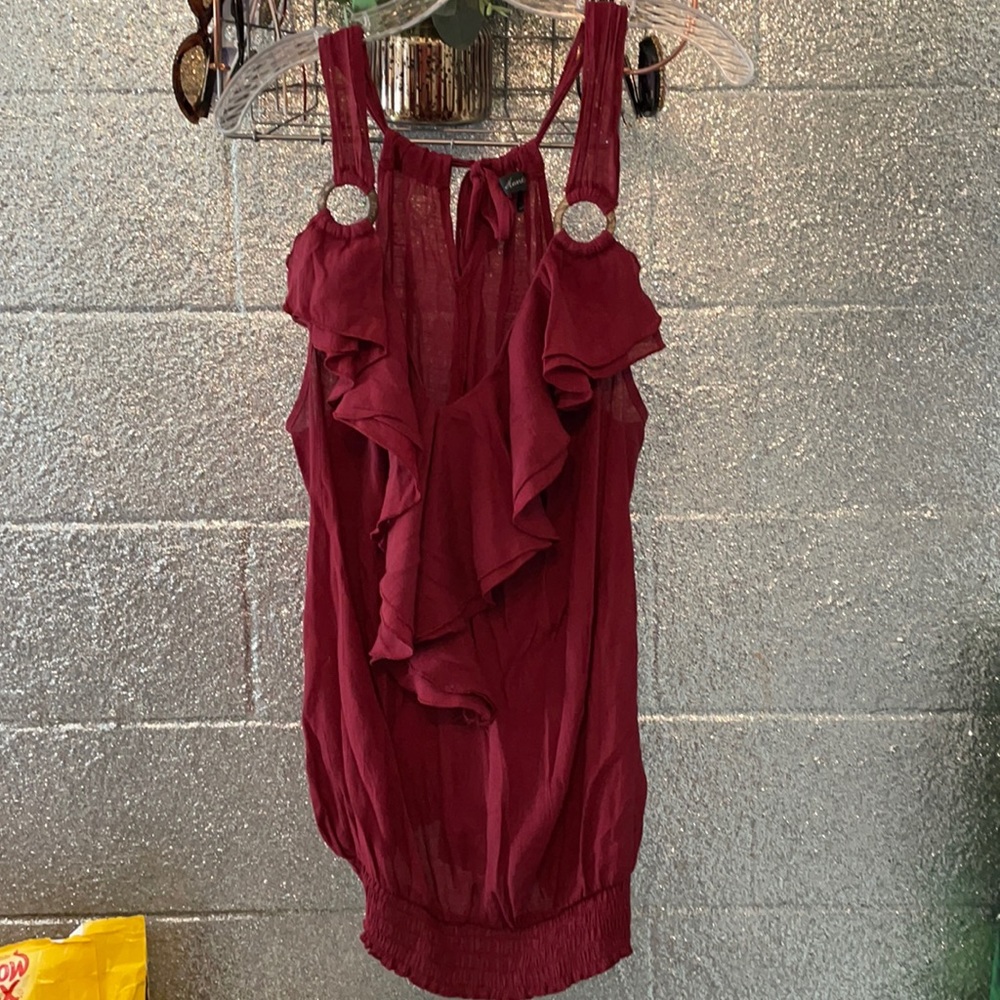 Maroon top. Ruffle with bamboo rings.